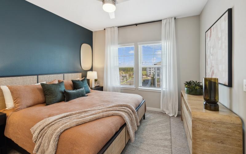 a bedroom with a large window