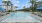 a pool with a building in the background