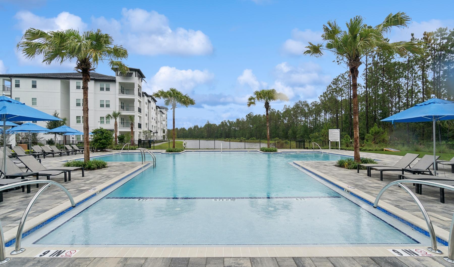 a pool with a building in the background