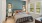a bedroom with a bed and lamps