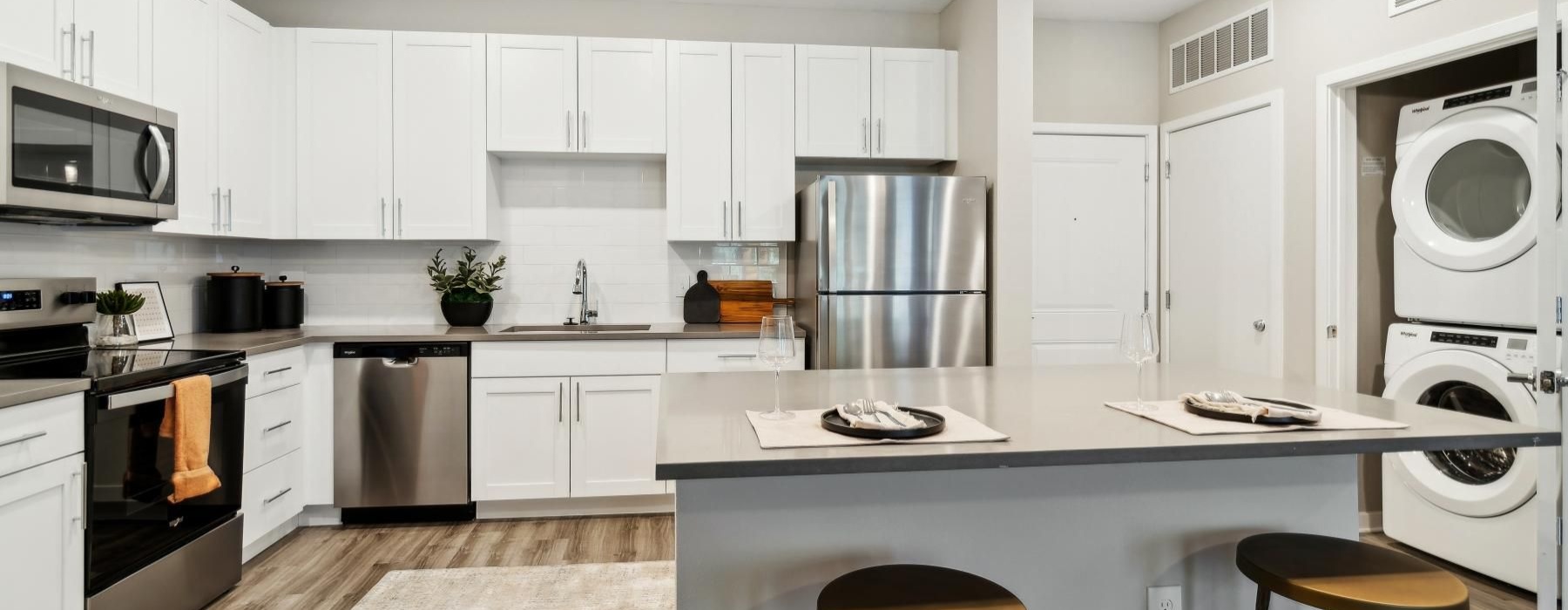 a kitchen with white cabinets