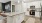 a kitchen with white cabinets