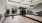a room with wood floors large mirror and workout equipment