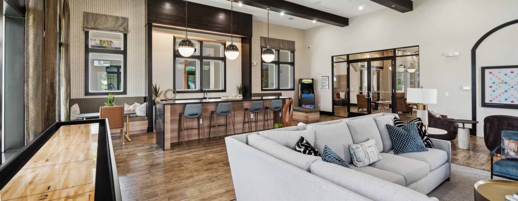 a living room with a large tv and a large mirror